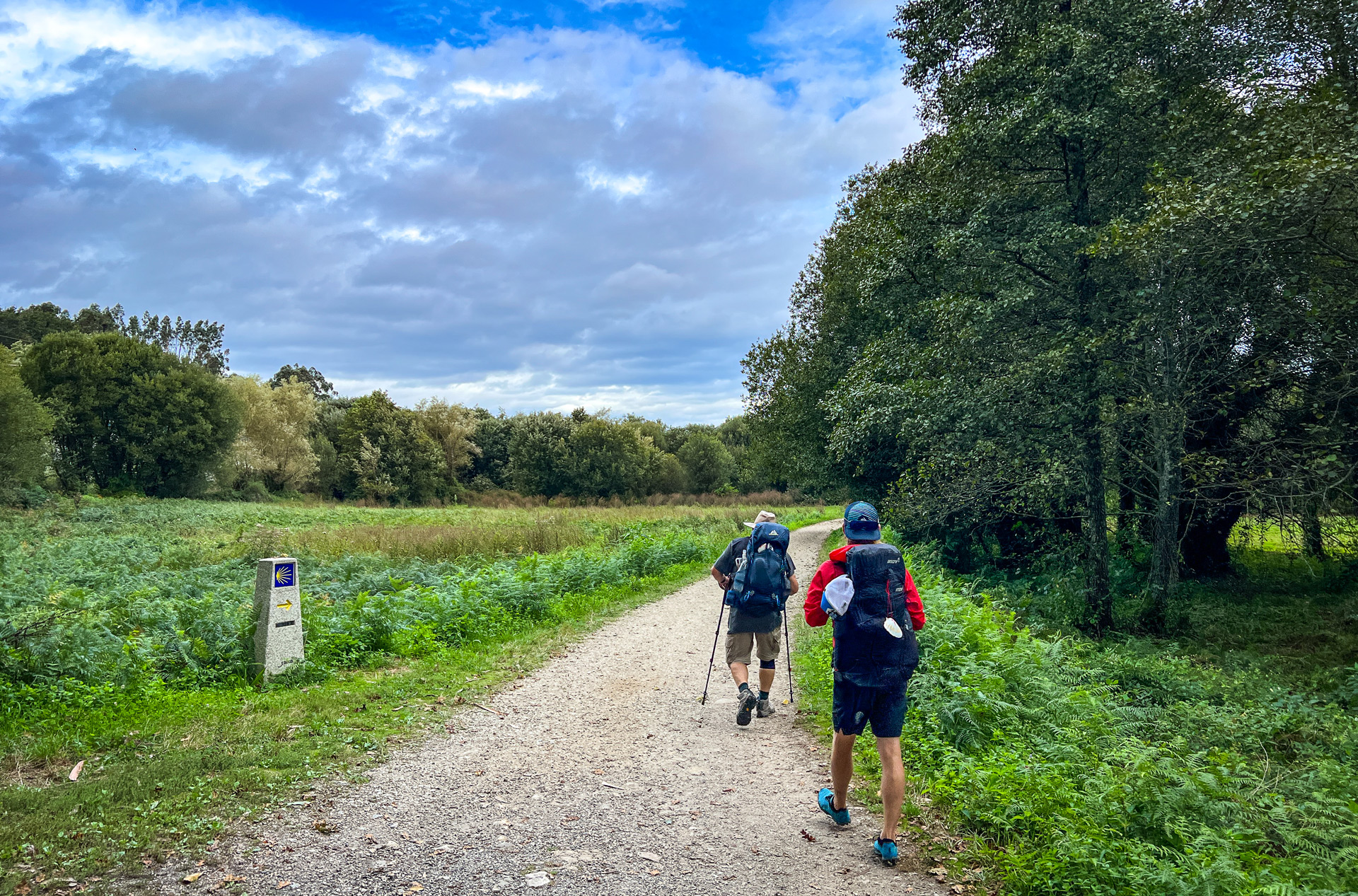 Tyler and Jim hiking along the Camino de Santiago Portuguese Route trail.